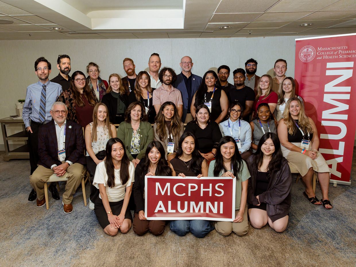MCPHS Optometry Alumni pose for a group picture. 