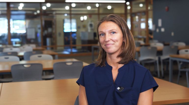 Abbie McCaffrey, MSOT '22, sits for an interview on her experience as an inpatient hospital occupational therapist and an MCPHS adjunct faculty member.