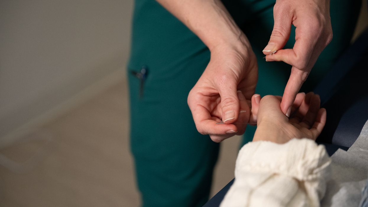 Students and faculty collaborating in the NESA acupuncture clinic on the MCPHS Worcester campus. 