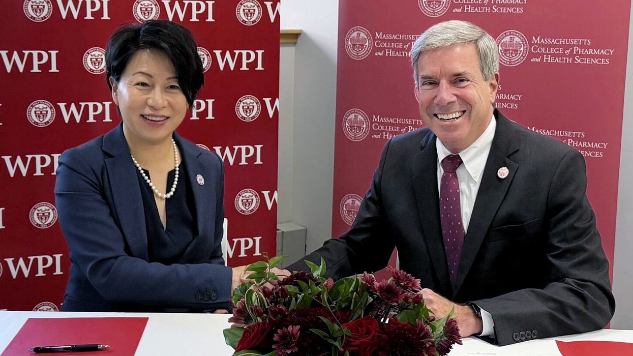WPI President Grace Wang and MCPHS President Richard J. Lessard.