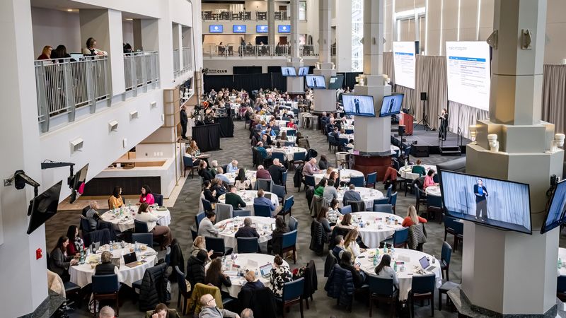 People sit at tables at the 2026 Reed Conference