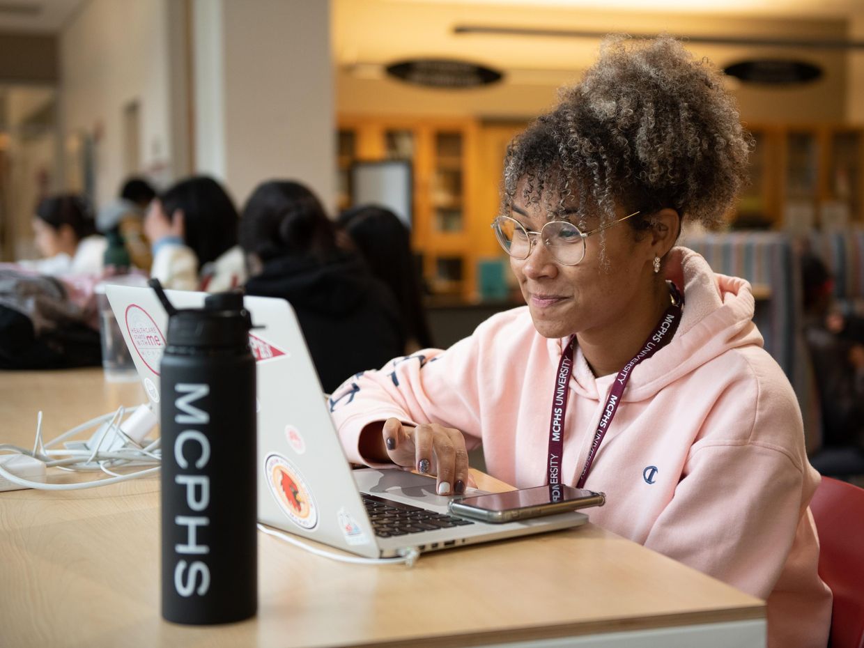 Female student on a laptop.