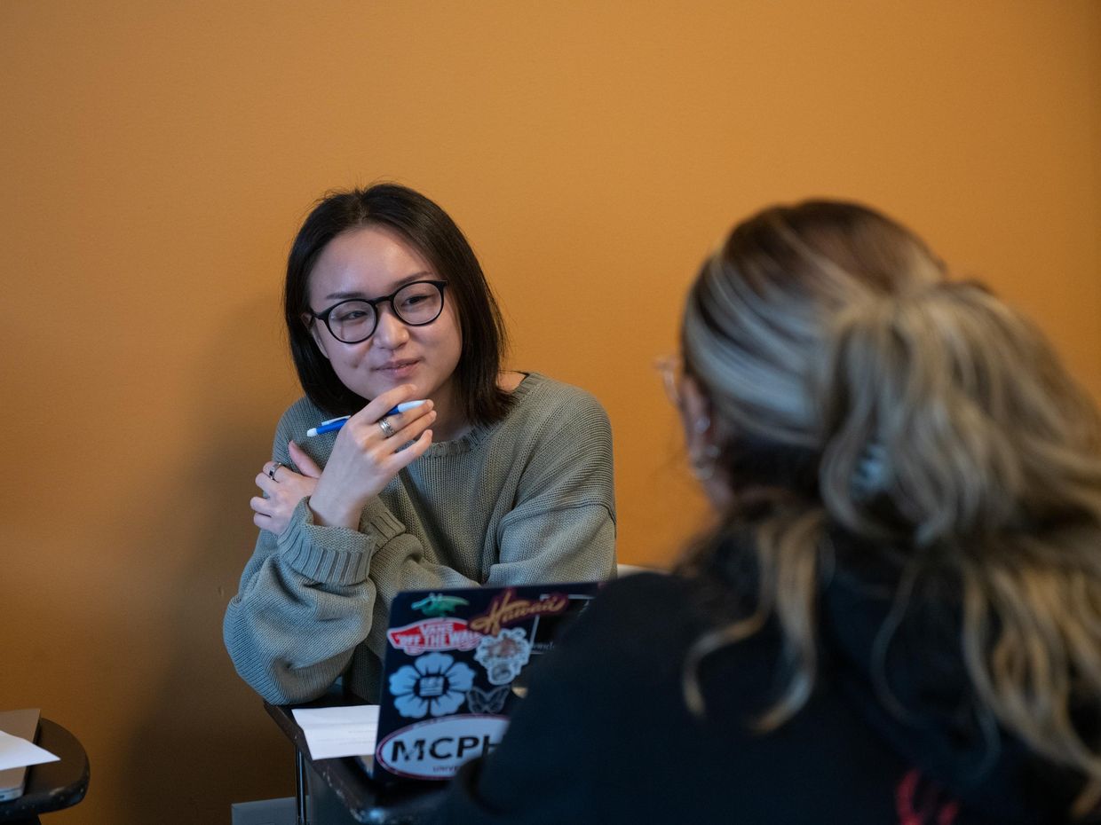 Female student with laptop open