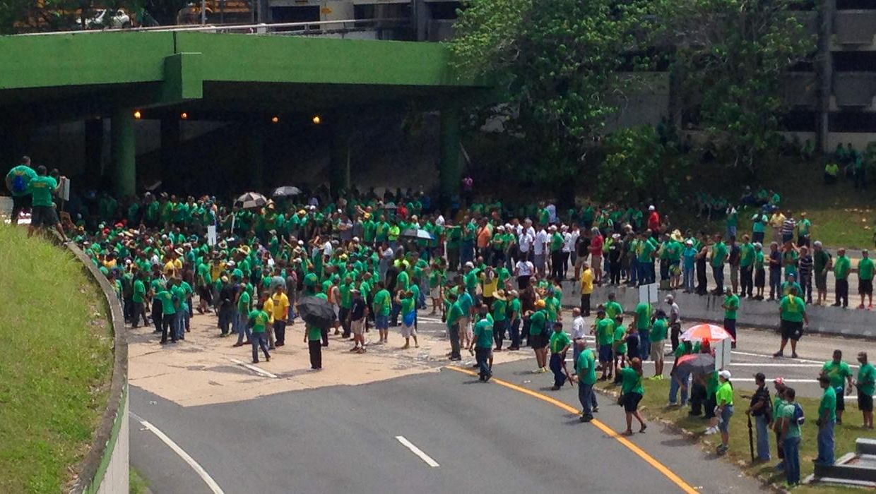 A group of protesters block a major highway in San Juan, Puerto Rico in June 2014.