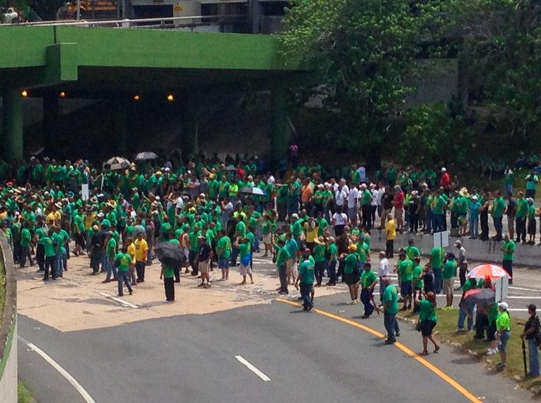 A group of protesters block a major highway in San Juan, Puerto Rico in June 2014.
