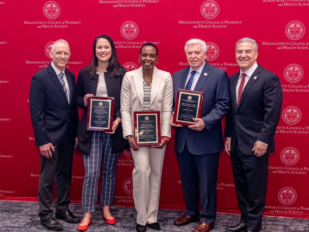 MCPHS Pharmacy Deans and Alumni holding awards at the 202 Reed confernce. 