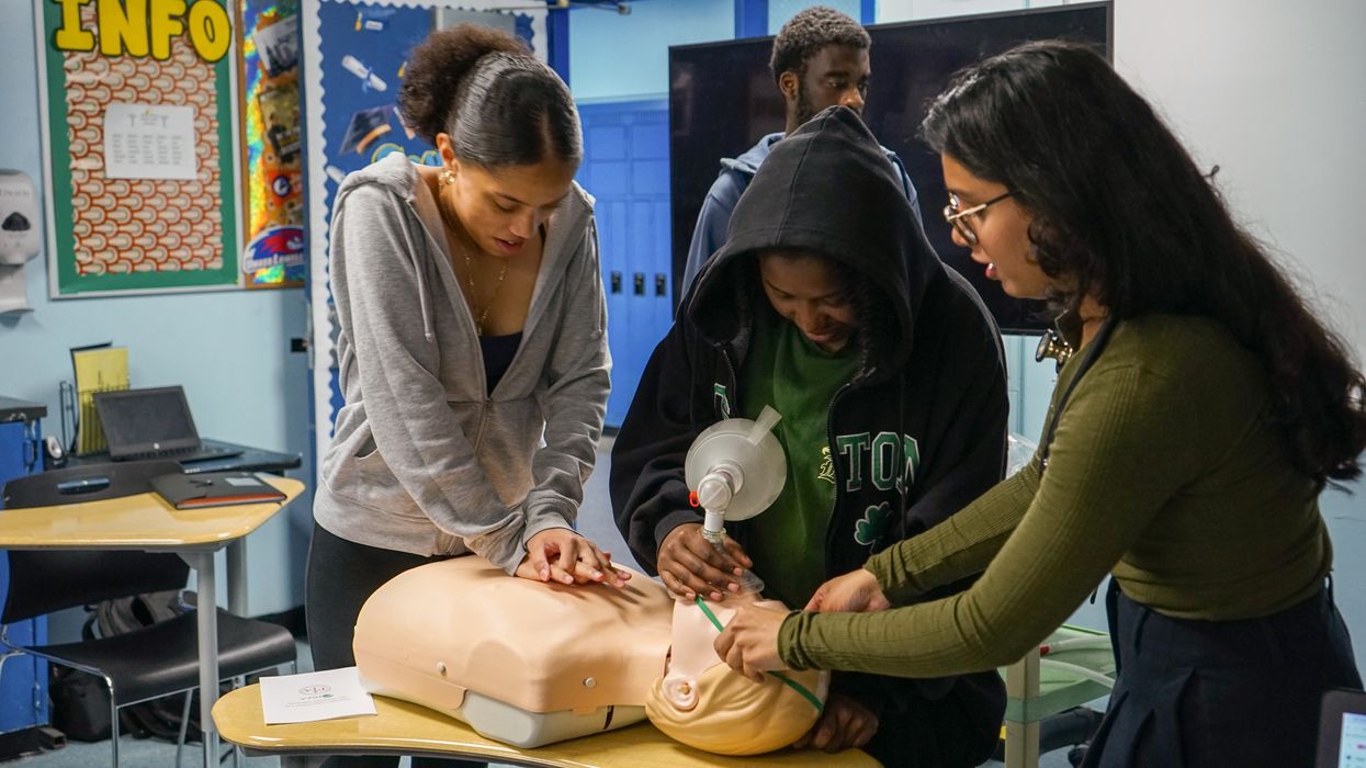 Students practice CPR skills.
