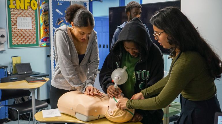Students practice CPR skills.