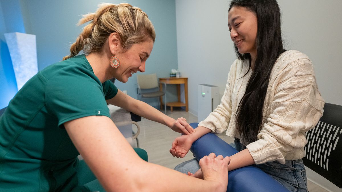 Students and faculty collaborating in the NESA acupuncture clinic on the MCPHS Worcester campus. 