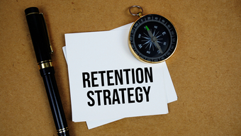 Compass, pen, retention strategy text.