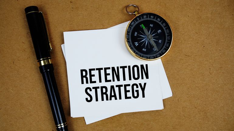 Compass, pen, retention strategy text.