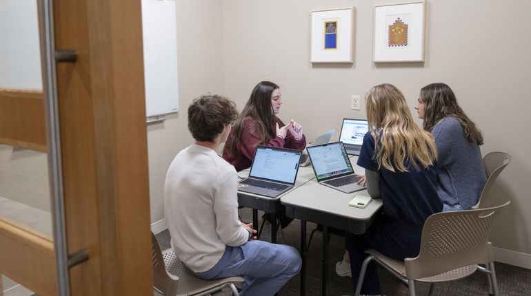 Manchester students hanging out and studying in the Brant Hub on the Manchester Campus. 