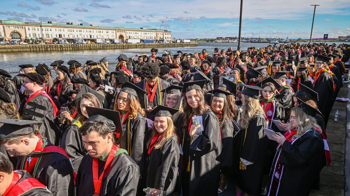 Students process to MCPHS Commencement 2024.