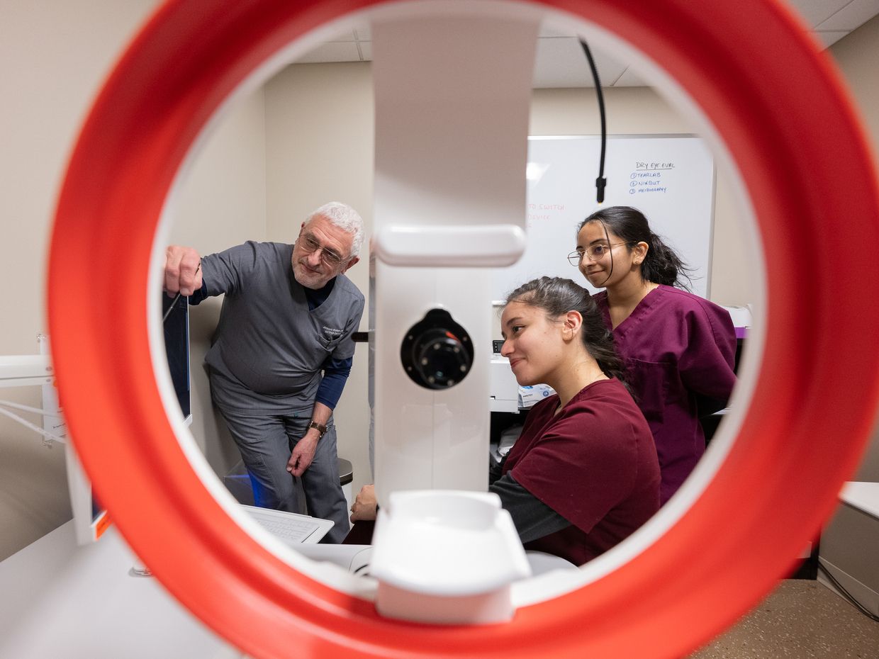 Optometry students on the MCPHS Worcester Campus collaborating and using different optometry tools and equipment.