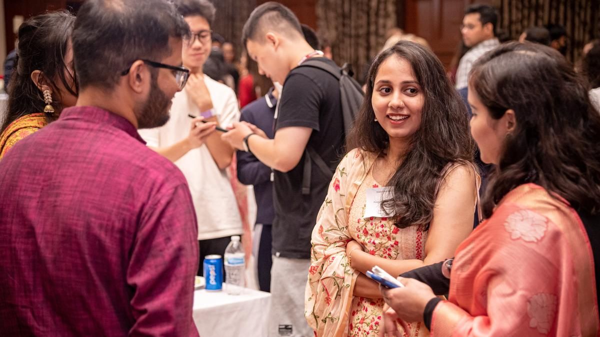 International students and parents at a reception. 