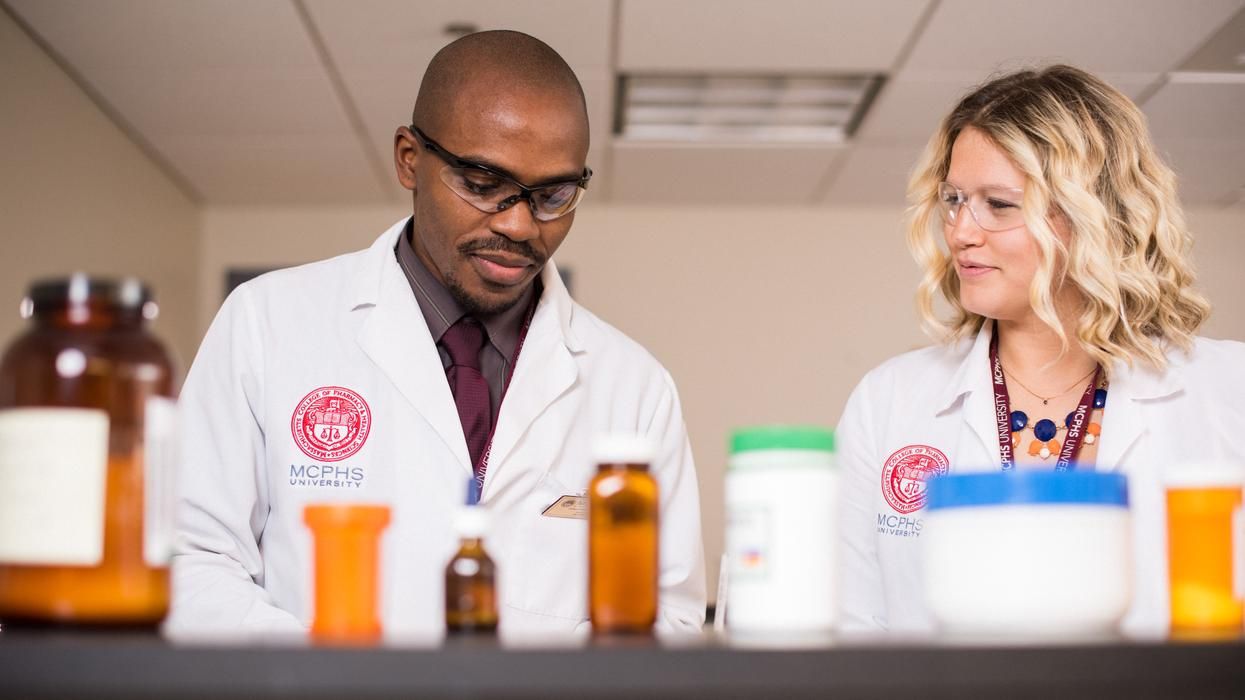 Male and female pharmacy students in the lab. 