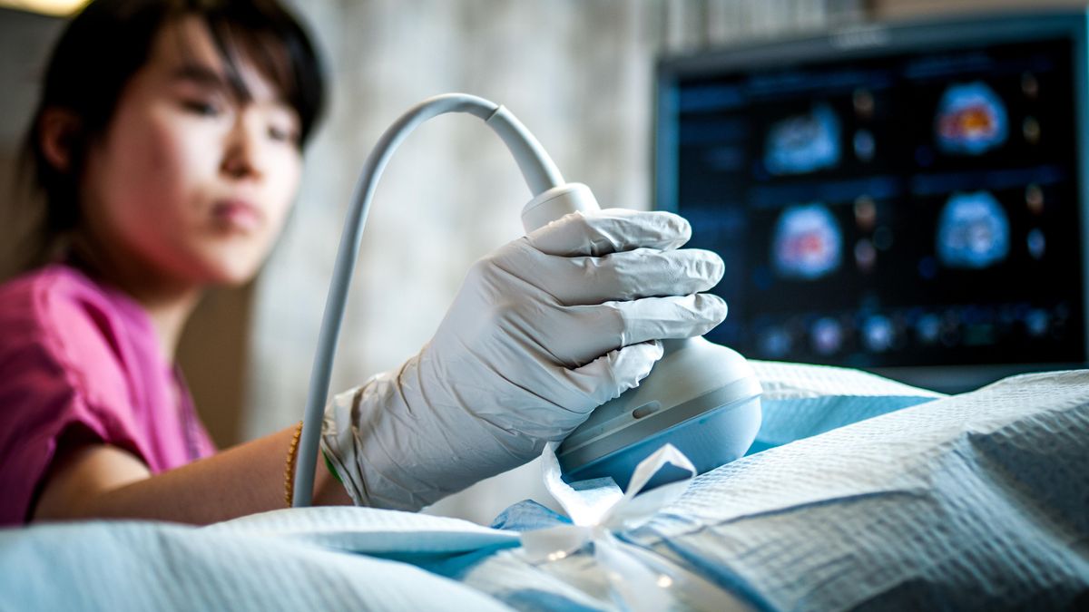 Student in MCPHS Diagnostic Medical Sonography lab.