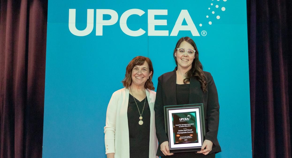 Amber Palmer from the School of Professional Studies accepts the UPCEA award