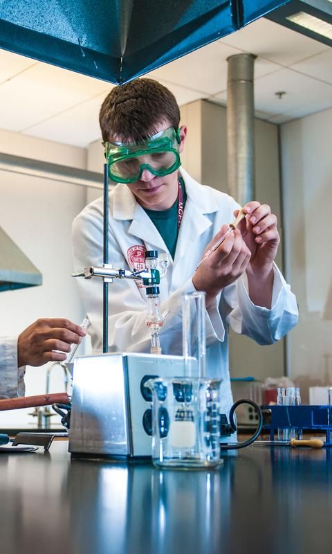 Male student in chemistry lab.