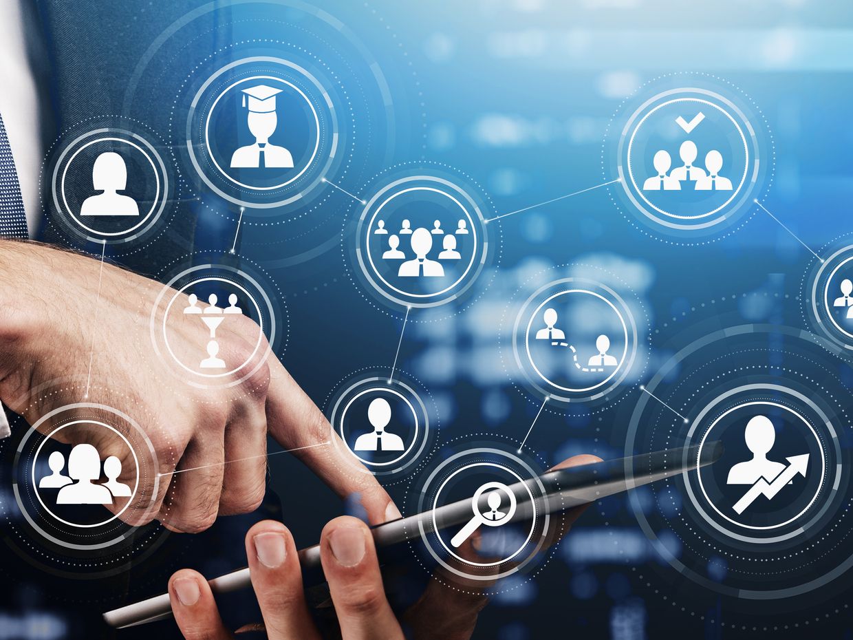 Side view of a hand using tablet device