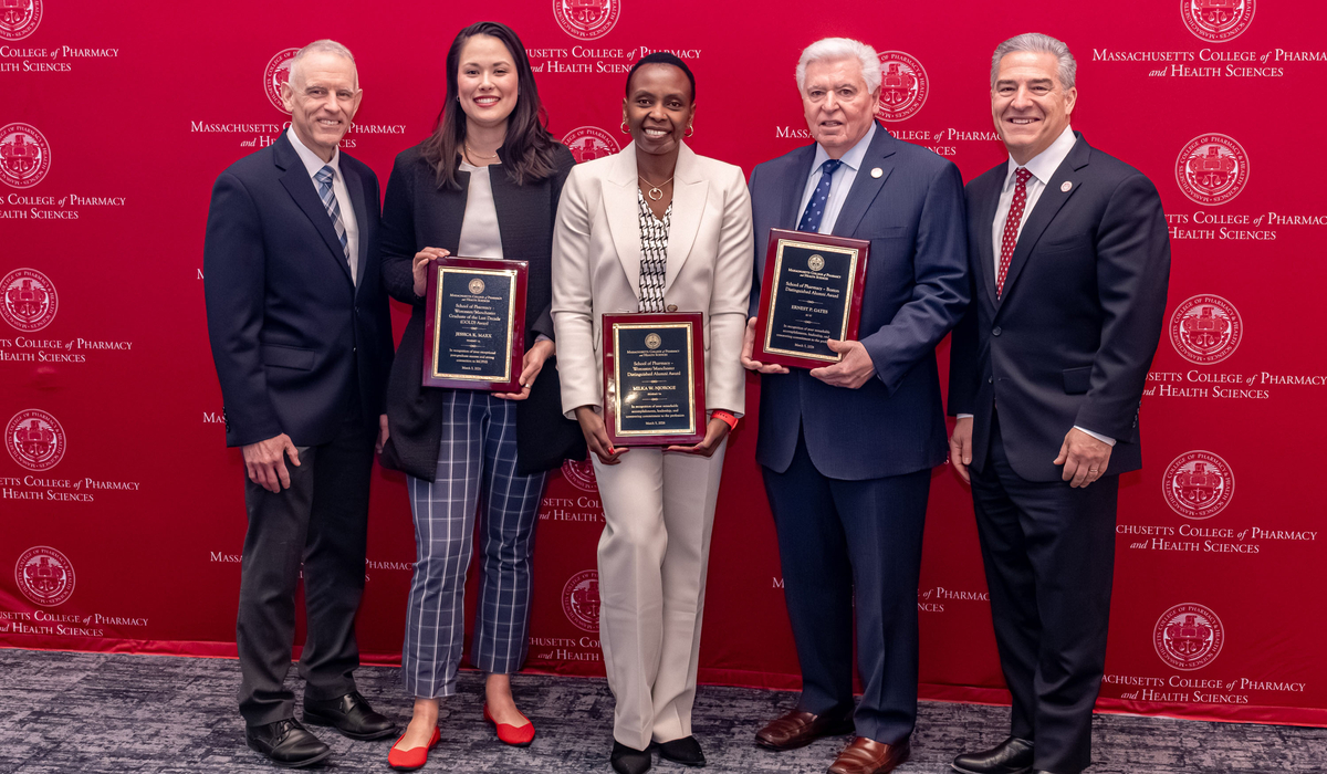 MCPHS Pharmacy Deans and Alumni holding awards at the 202 Reed confernce. 