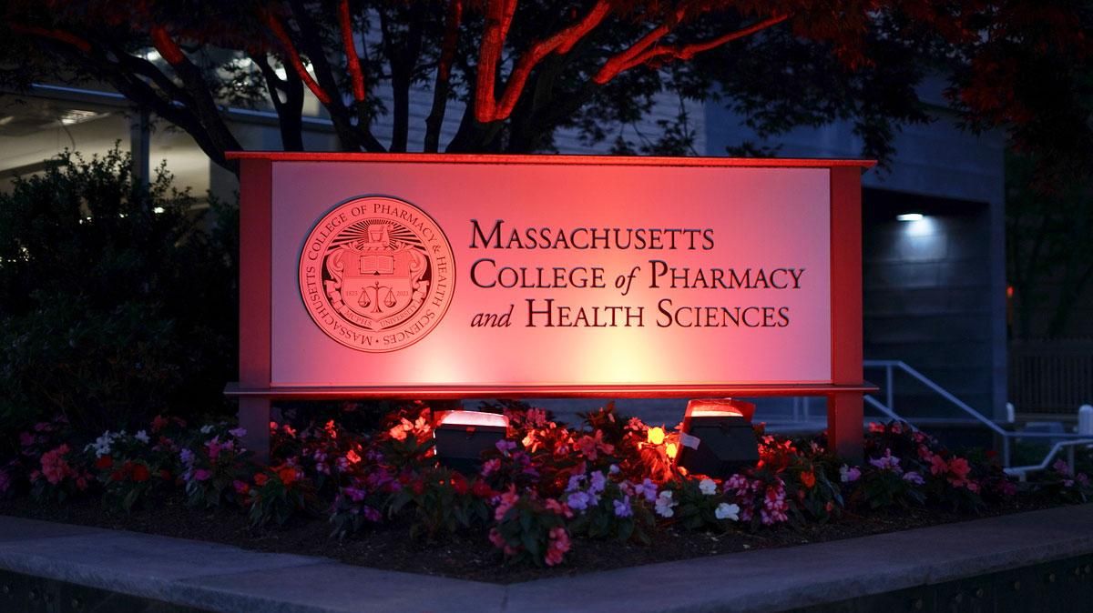 MCPHS sign with red lighting to celebrate Juneteenth