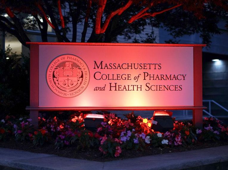 MCPHS sign with red lighting to celebrate Juneteenth