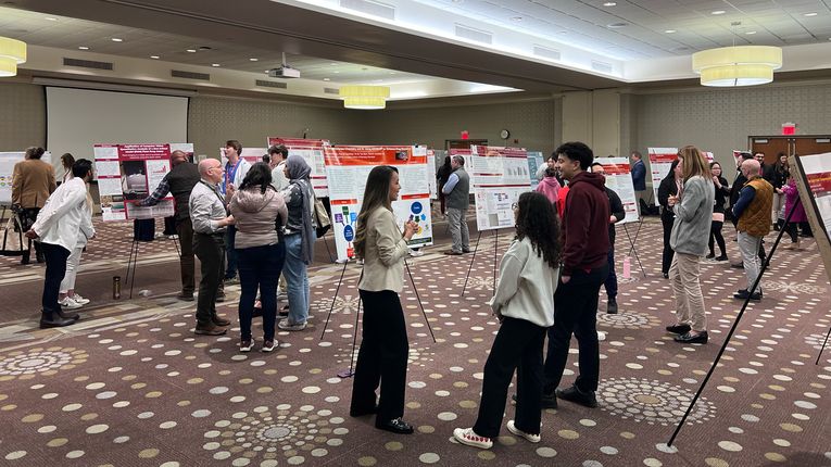 Students stand at the MCPHS Worcester/Manchester Research & Scholarship Showcase.