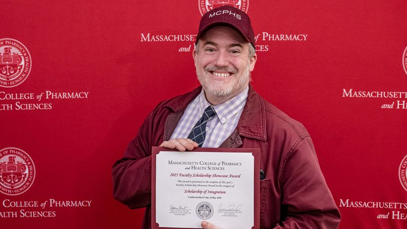Dr. A David Lewis received the Scholarship of Integration Award.