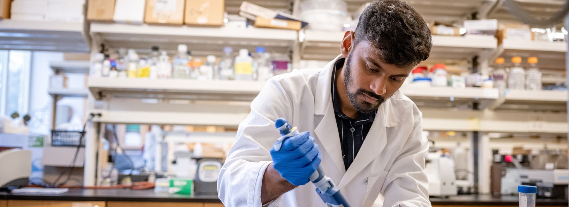 Male student in lab. 