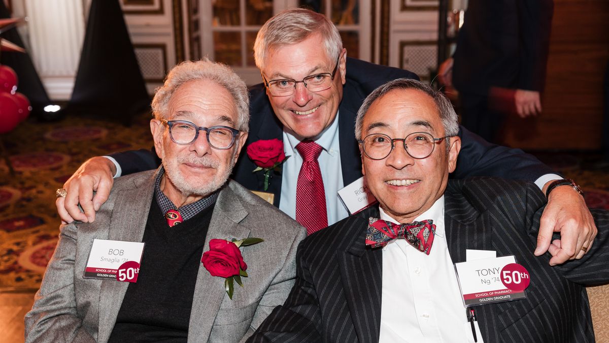 Three men pose for photo at MCPHS Reunion 2024