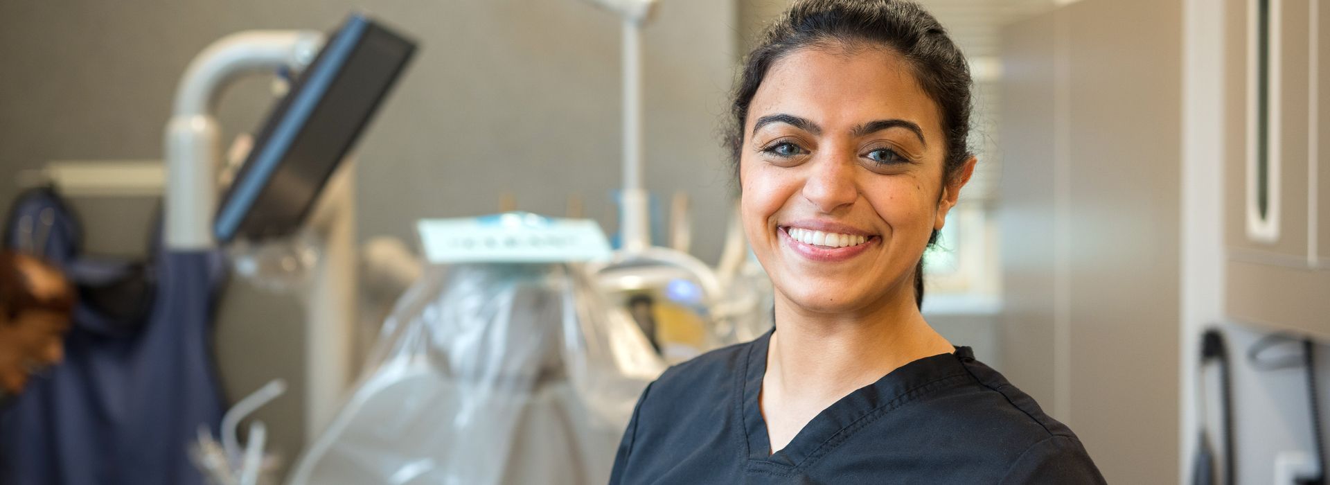 Smiling dental hygiene student.