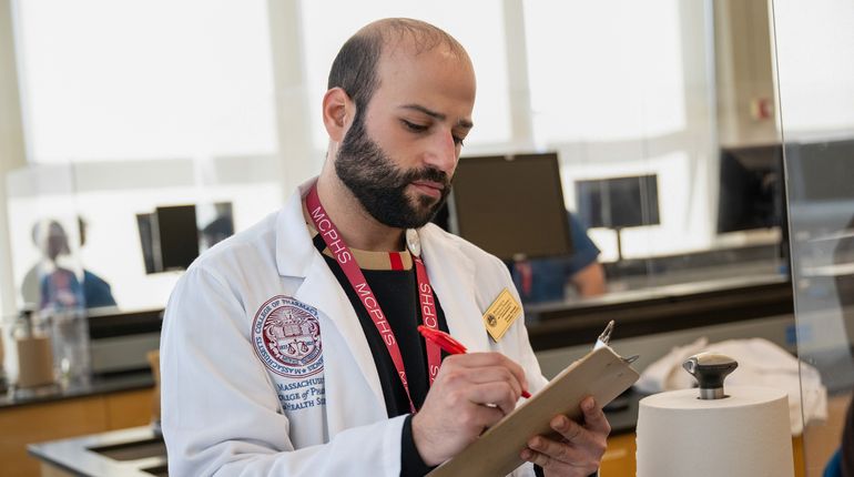 Pharmacy students working in lab and class on the Worcester campus
