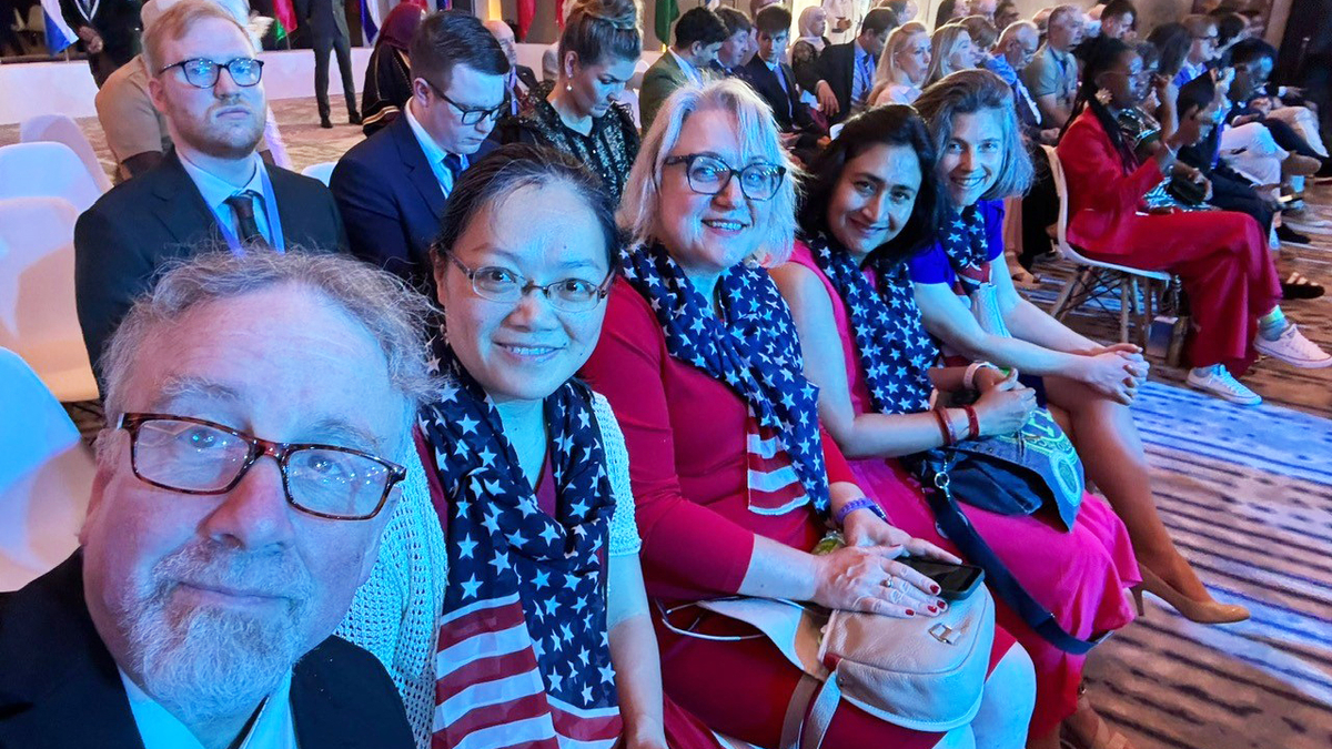 MCPHS Chemistry Professor Songwen Xie, second from left, with the coaches at the 57th International Chemistry Olympiad (IChO), which ran July 5 to July 14, in Dubai.