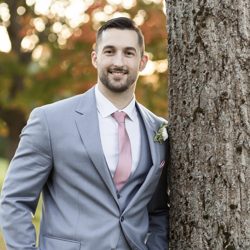 Michael Soden standing next to a tree.