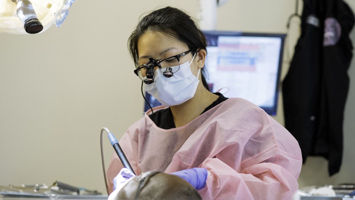 Dental hygiene student with patient. 