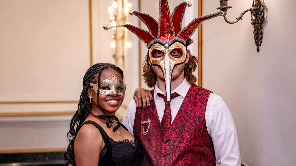 Two students dressed in masks.