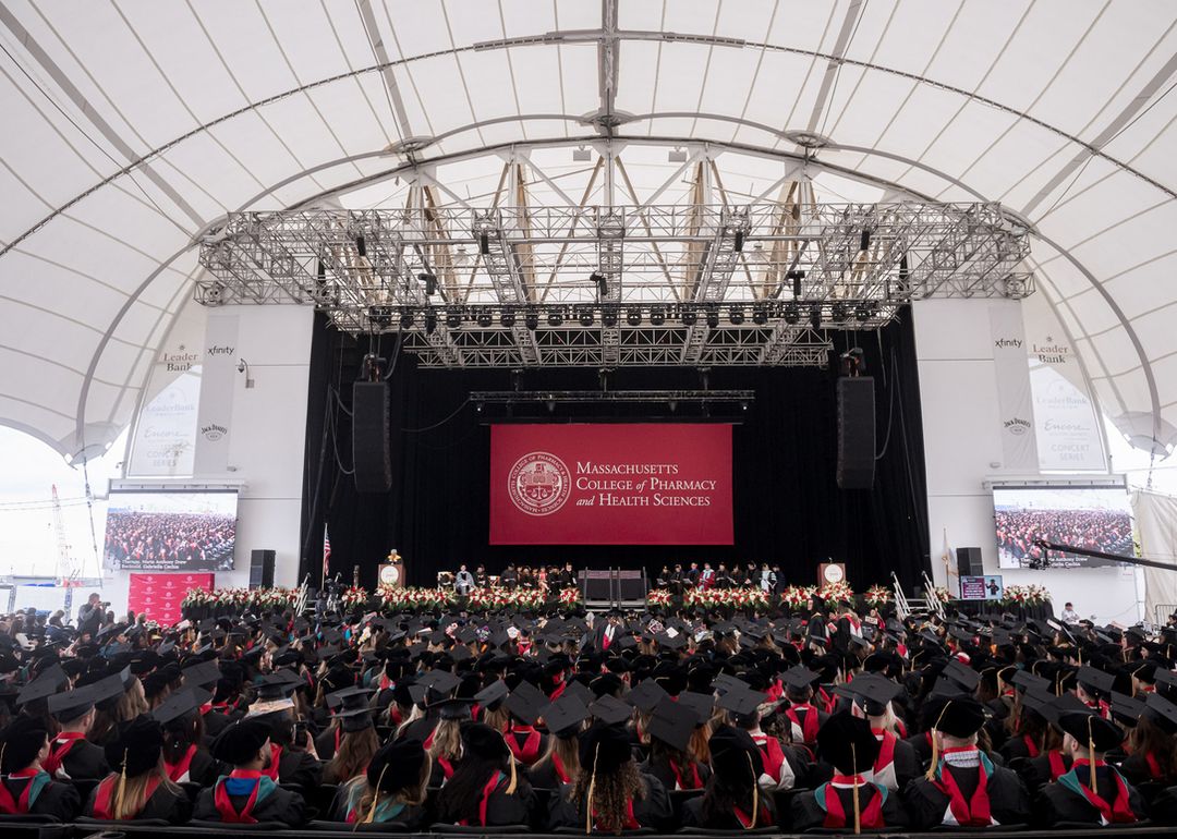 MCPHS students sitting at Leader Bank Pavillion for Commencement