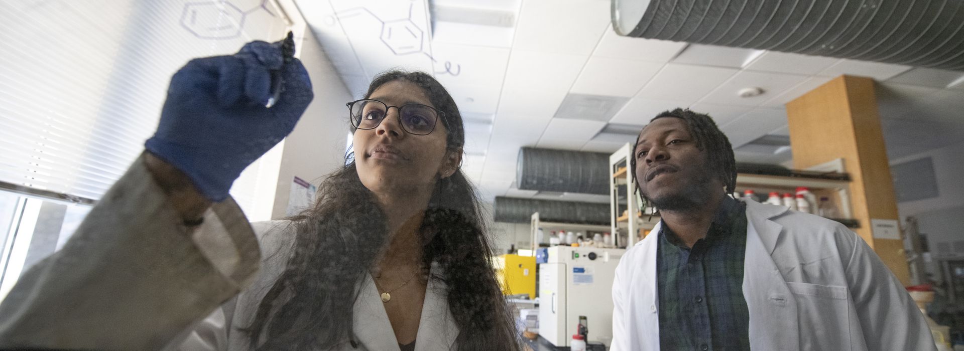 Two students in the chemistry lab. 