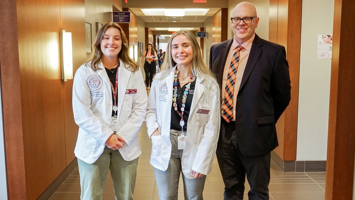 Kambrie Clinton, MSOT '25, and Haley Samara, DPT '26, with the group's faculty advisor, Dr. Stephen Cina.