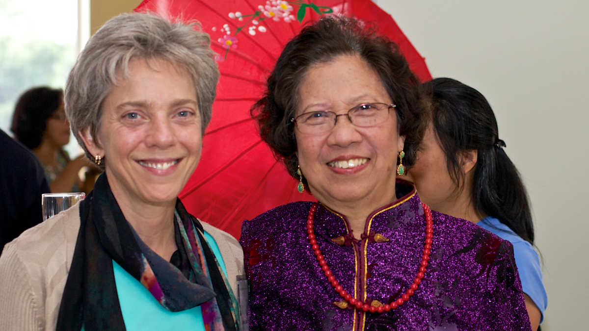 Amy Hull, left, and Mrs. So, the wife of NESA's founder, at the Class of 2014 graduation. 