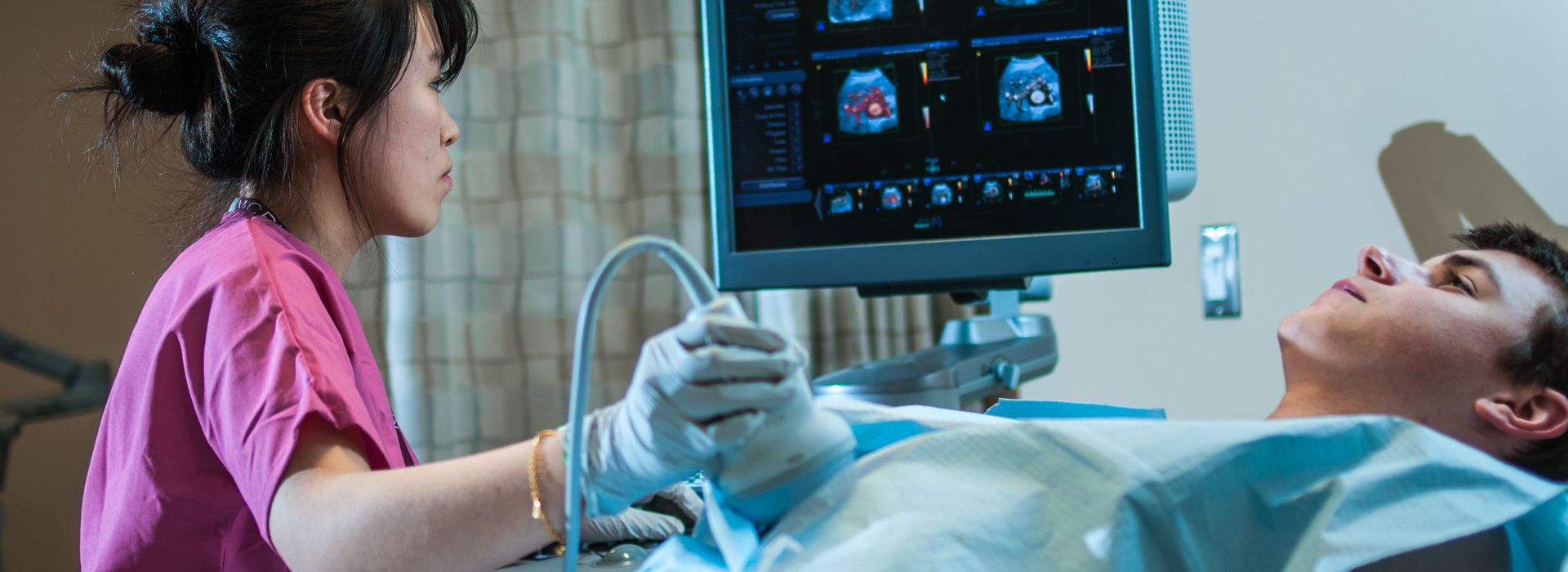Student in MCPHS Diagnostic Medical Sonography lab.