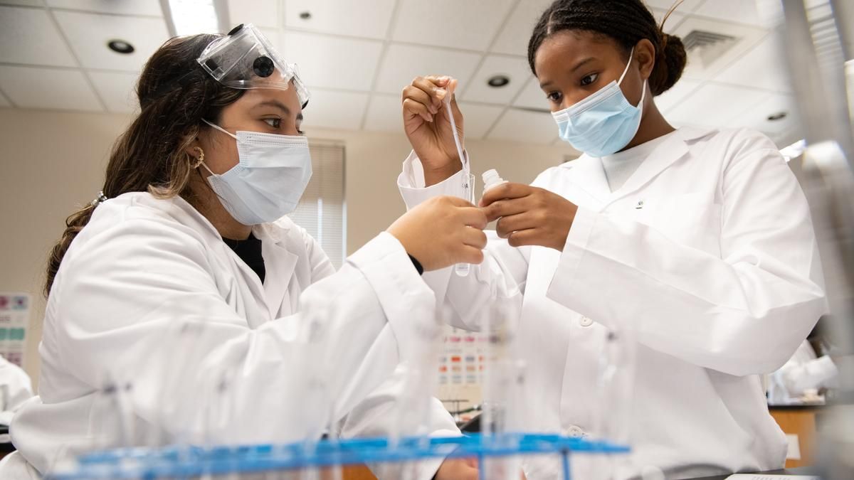 Students collaborating in lab space