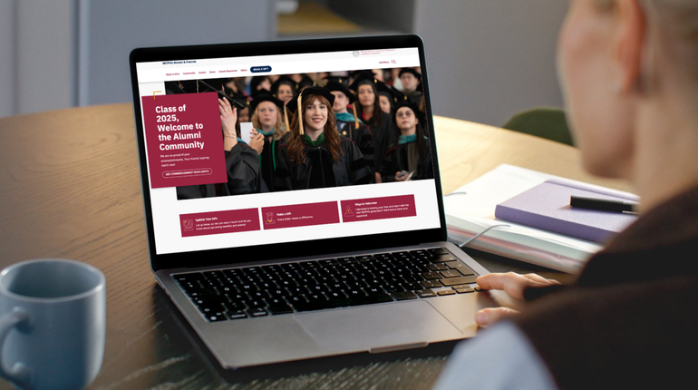 Laptop with Alumni News on the screen.