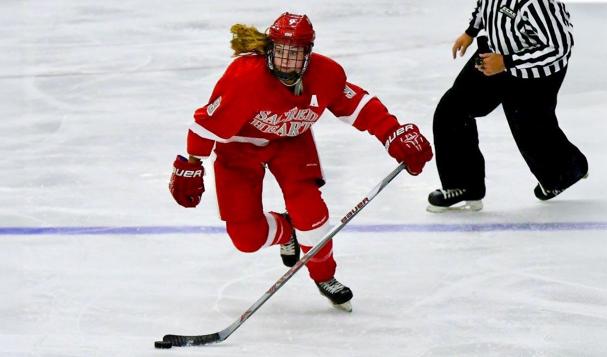 Brittany Moore playing ice hockey