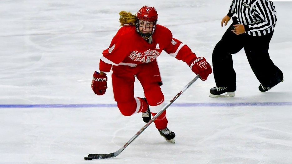Brittany Moore playing ice hockey