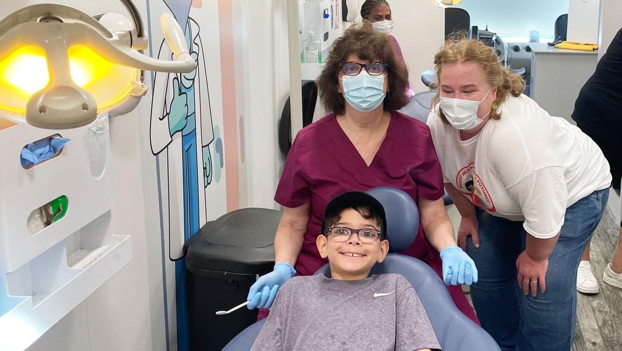 Dental Hygiene student with pediatric patient in mobile dental van.