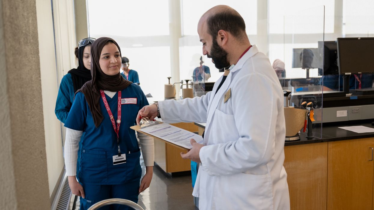 Pharmacy students working in lab and class on the Worcester campus