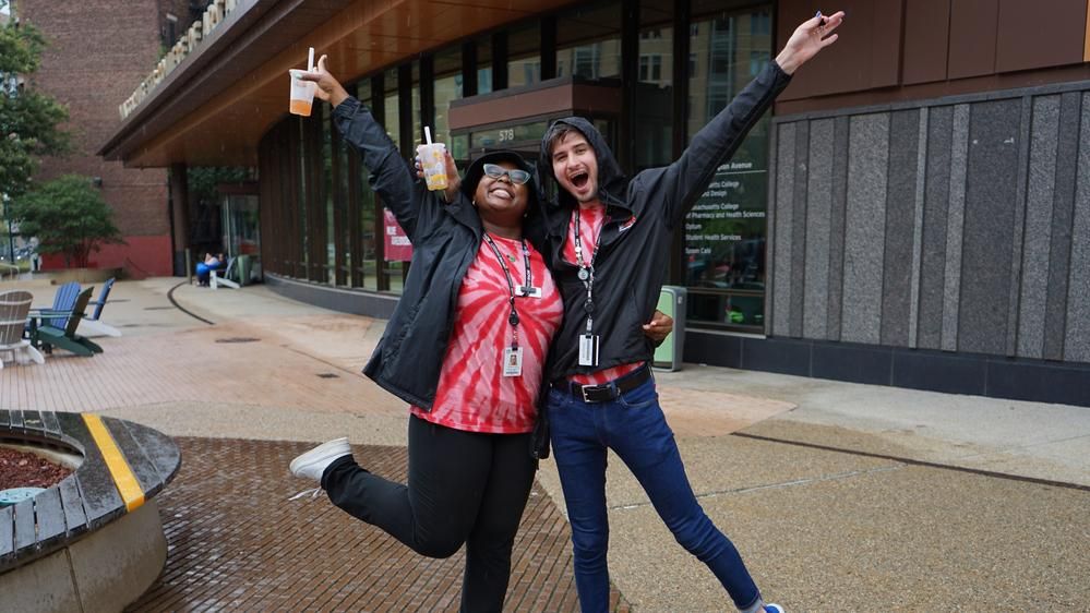 Two MCPHS students at Move-In Day pose for the camera.