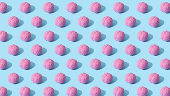 Repeating pattern of pink, brain-like objects on a light blue background